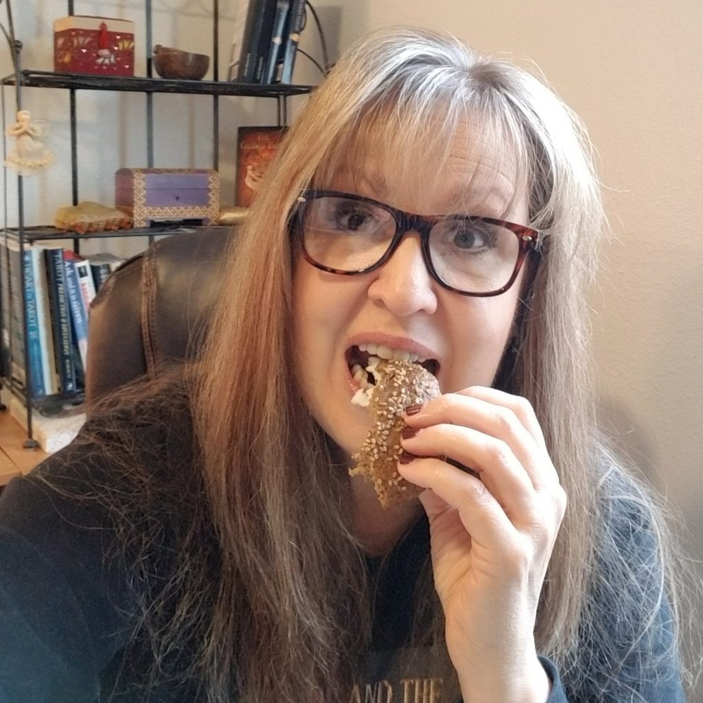 Tracy Eating Omega Bun Breakfast Sandwich